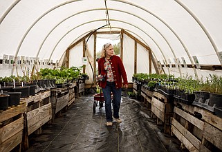 Staff file photo / Mary Ann Mears browses past plants in a greenhouse at the Crabtree Farms Spring Plant Sale and Festival in 2019. Crabtree Farms will host its 24th annual Spring Plant Sale and Festival from 9 a.m.-3 p.m. Friday-Saturday and 11 a.m.-3 p.m. Sunday at 1000 E. 30th St.